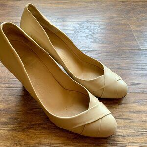 Cream Ferragamo heels, size 8.5 in cream. 3 inch wooden heel